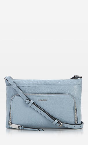 A blue Calvin Klein brand crossbody bag