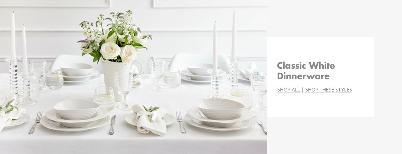 Creative shot of table setting using white dinnerware